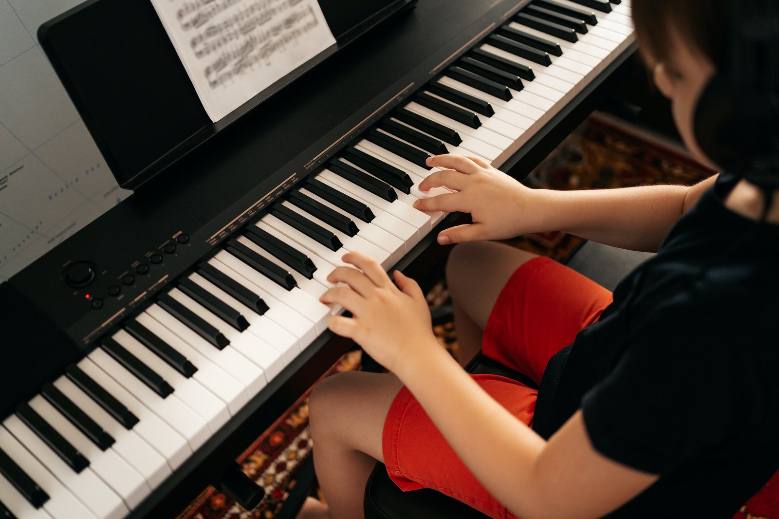 school-boy-playing-synthesizer-at-home.jpg